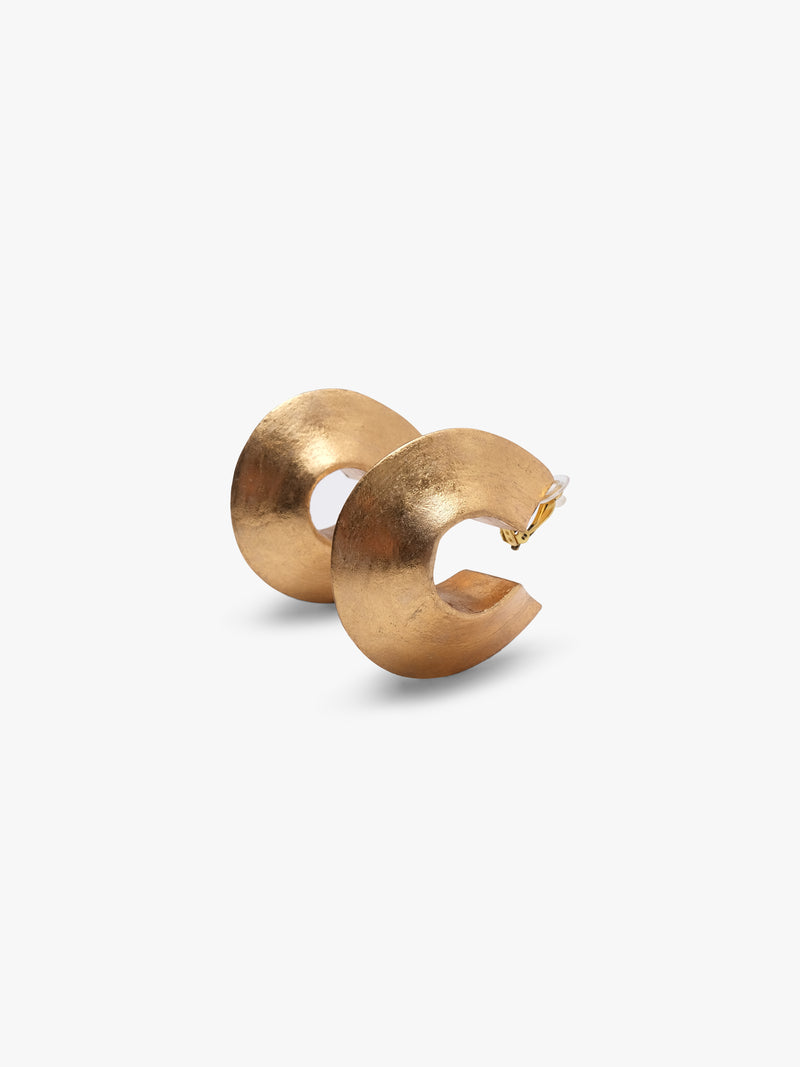 Pair of gold hoop earrings on a white background