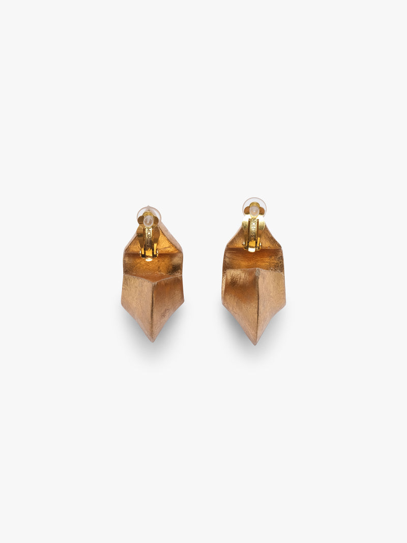 Pair of gold hoop earrings on a white background
