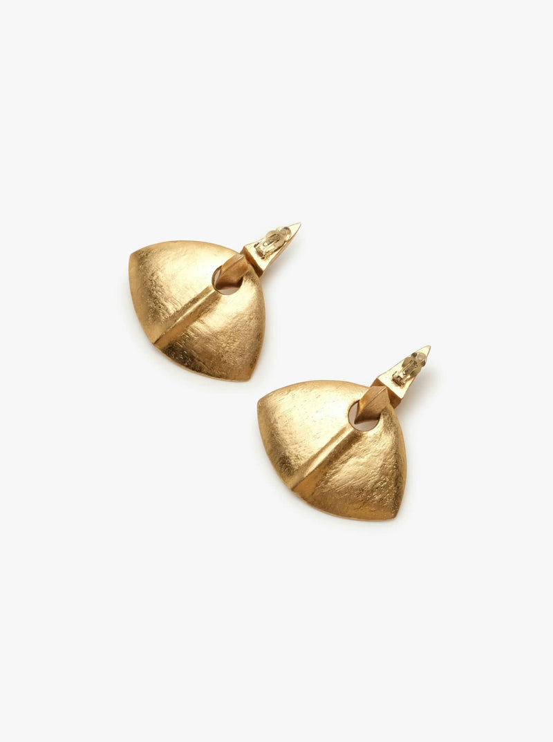 A pair of gold-colored clip-on earrings with a geometric design, featuring acacia wood and goldfoil.