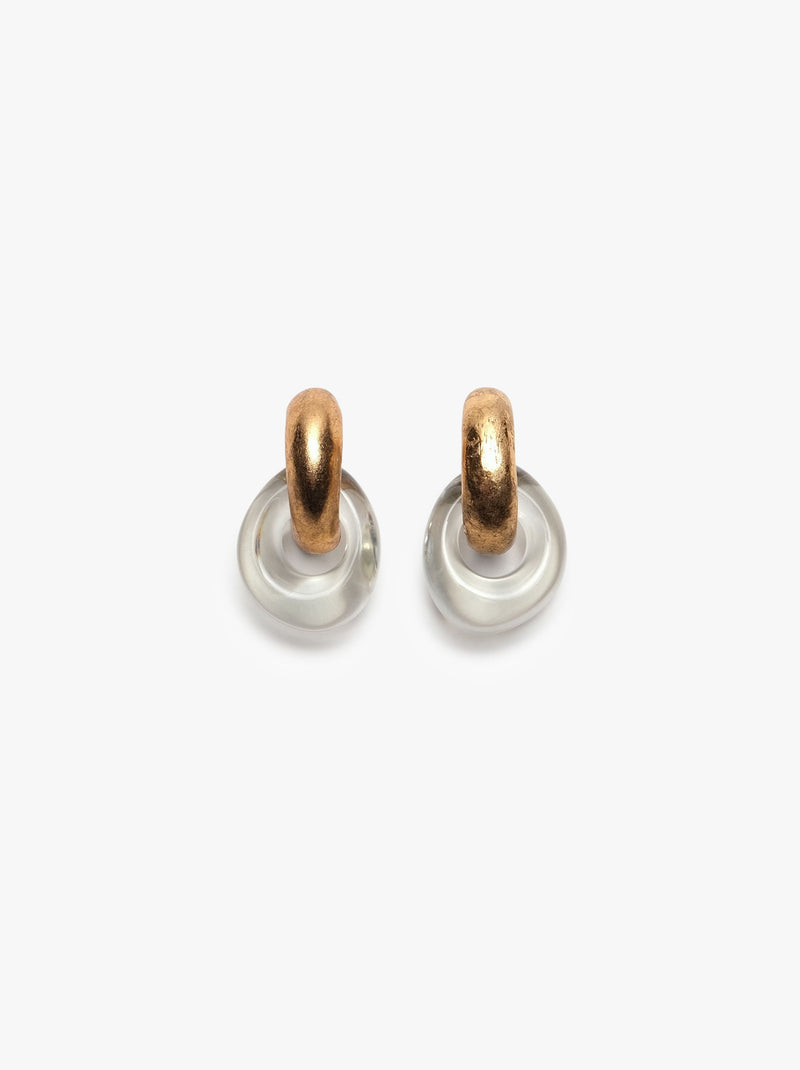 A pair of Havana earrings featuring clear and gold colors with earclips, made from acrylic and gold foil, displayed against a white background.