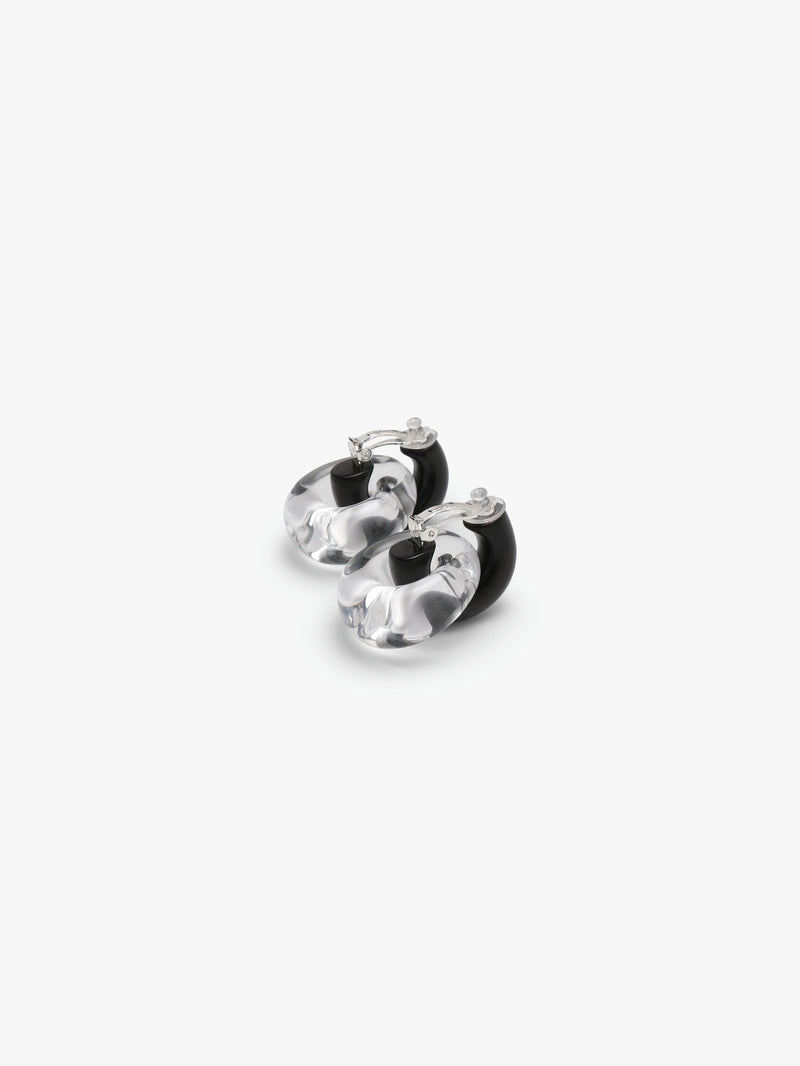 black and clear earrings on a white background