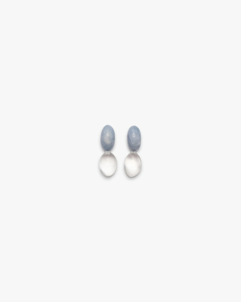 Blue and clear earrings displayed on a white background