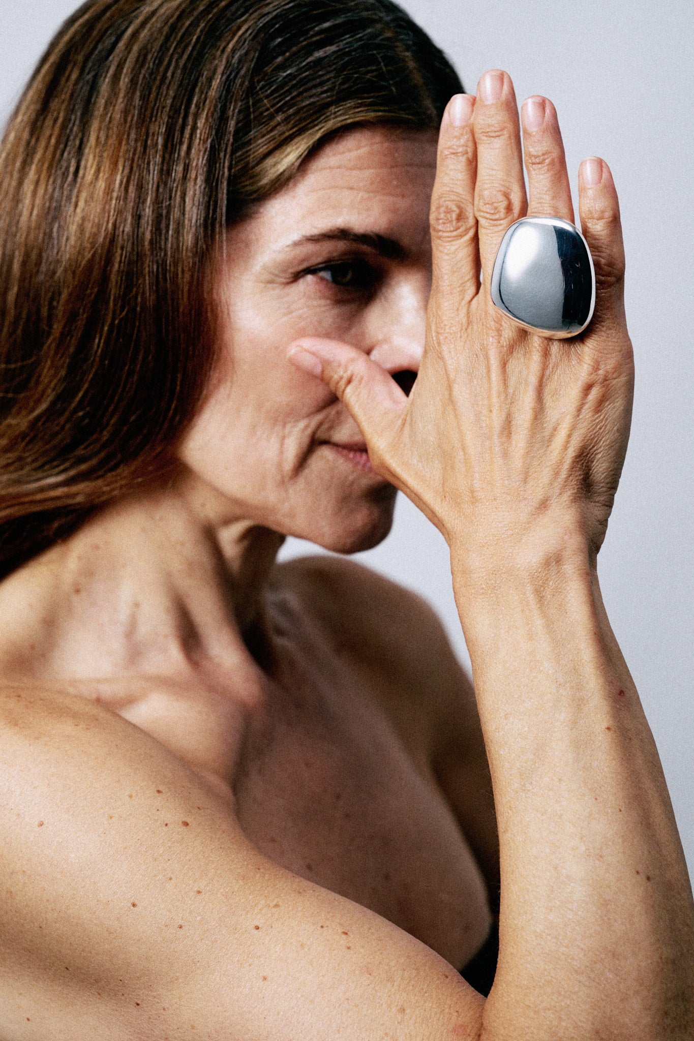 Anniversary ring: sterling silver, black leather