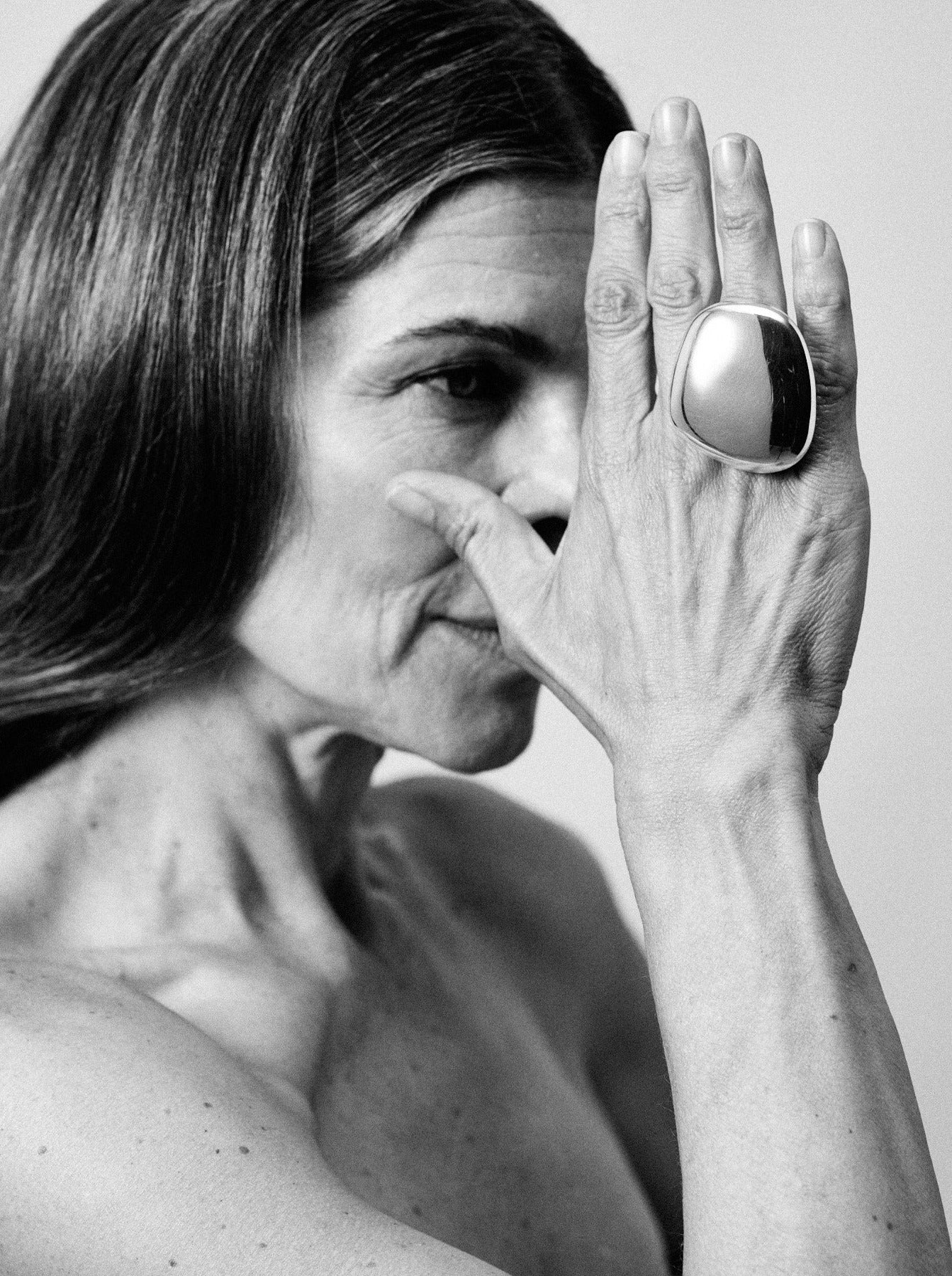 Anniversary ring: sterling silver, black leather