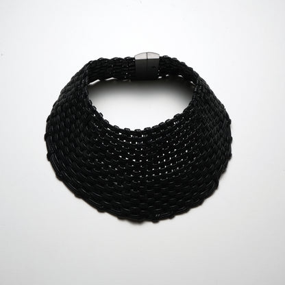 Necklace: leather, ebony