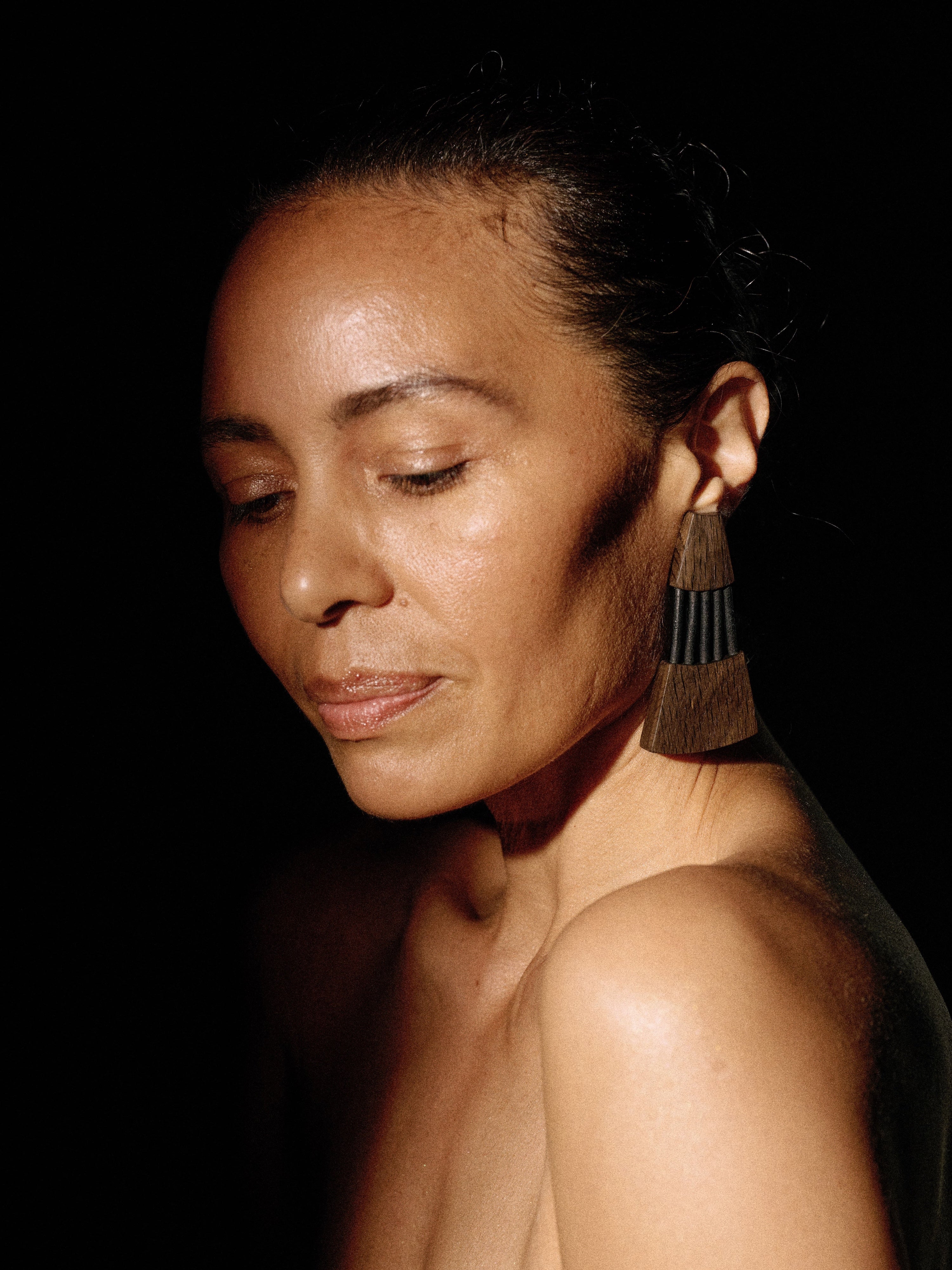 Bolira earrings:  bog oak, leather