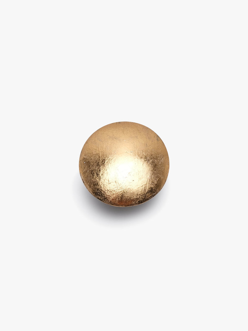 A gold-colored ring with a leather strap and a goldfoil finish, displayed on a white background.