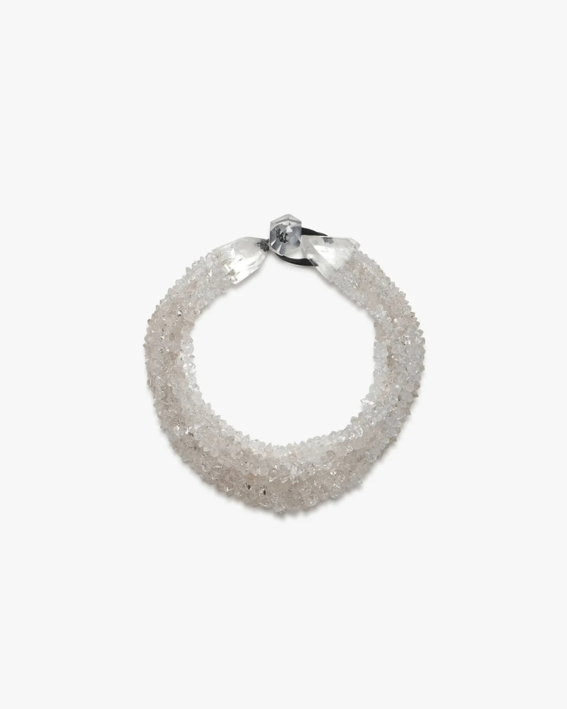 A textured, circular cuff necklace made of clear, faceted crystal or glass beads, secured with a silver-toned metal clasp, shown on a plain white background.