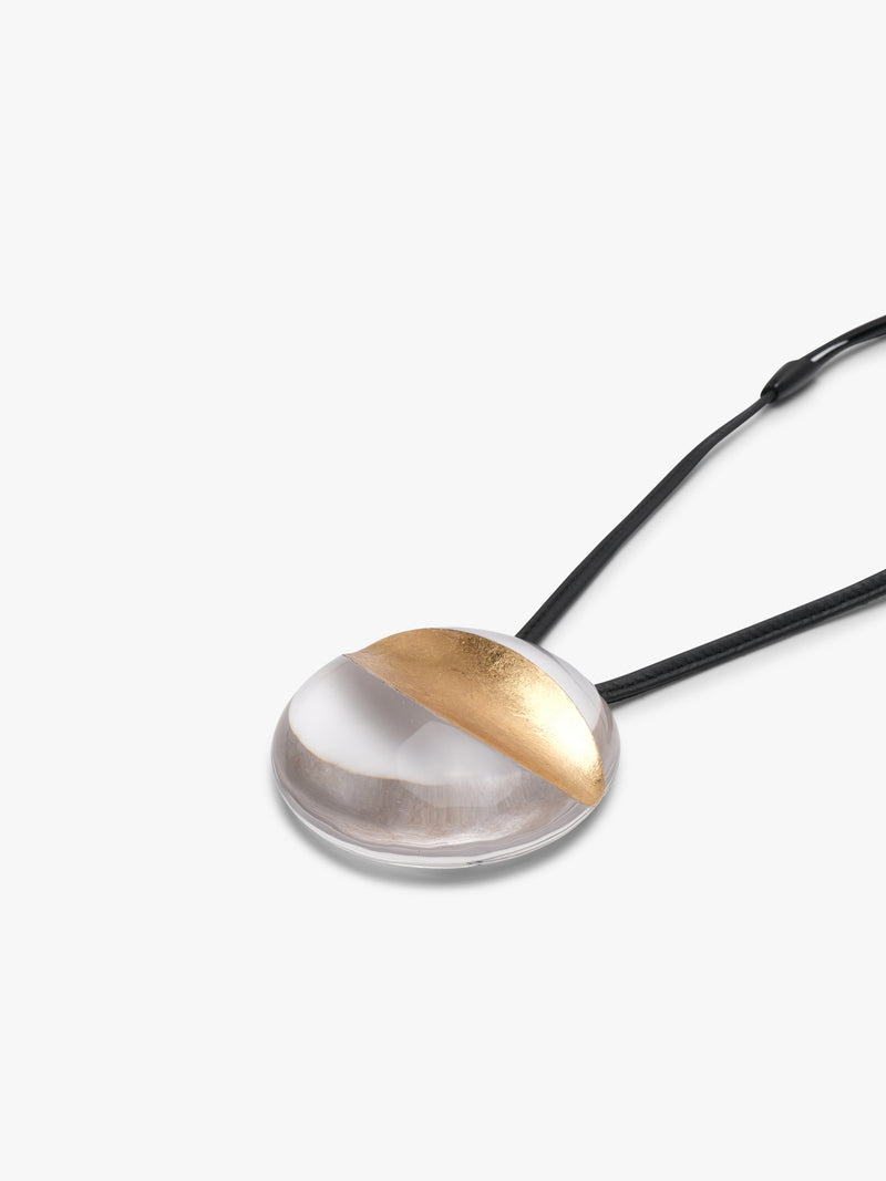 Isola pendant: greencast acrylic, leather, goldfoil