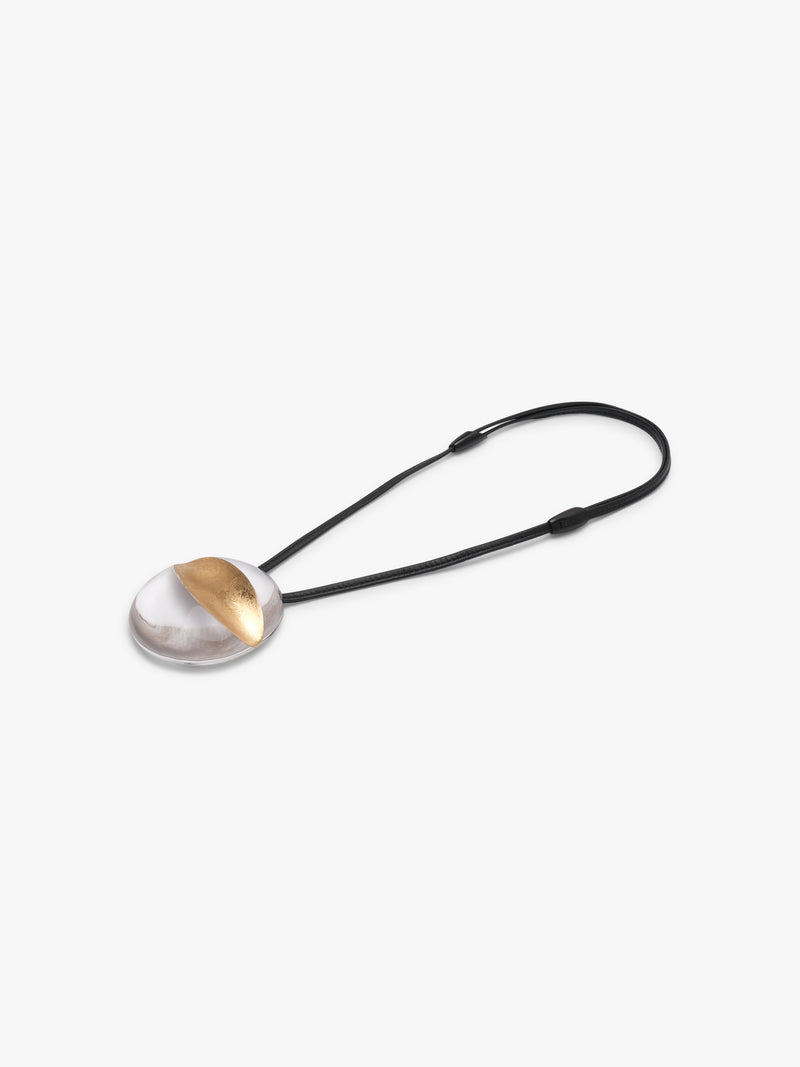 Isola pendant: greencast acrylic, leather, goldfoil