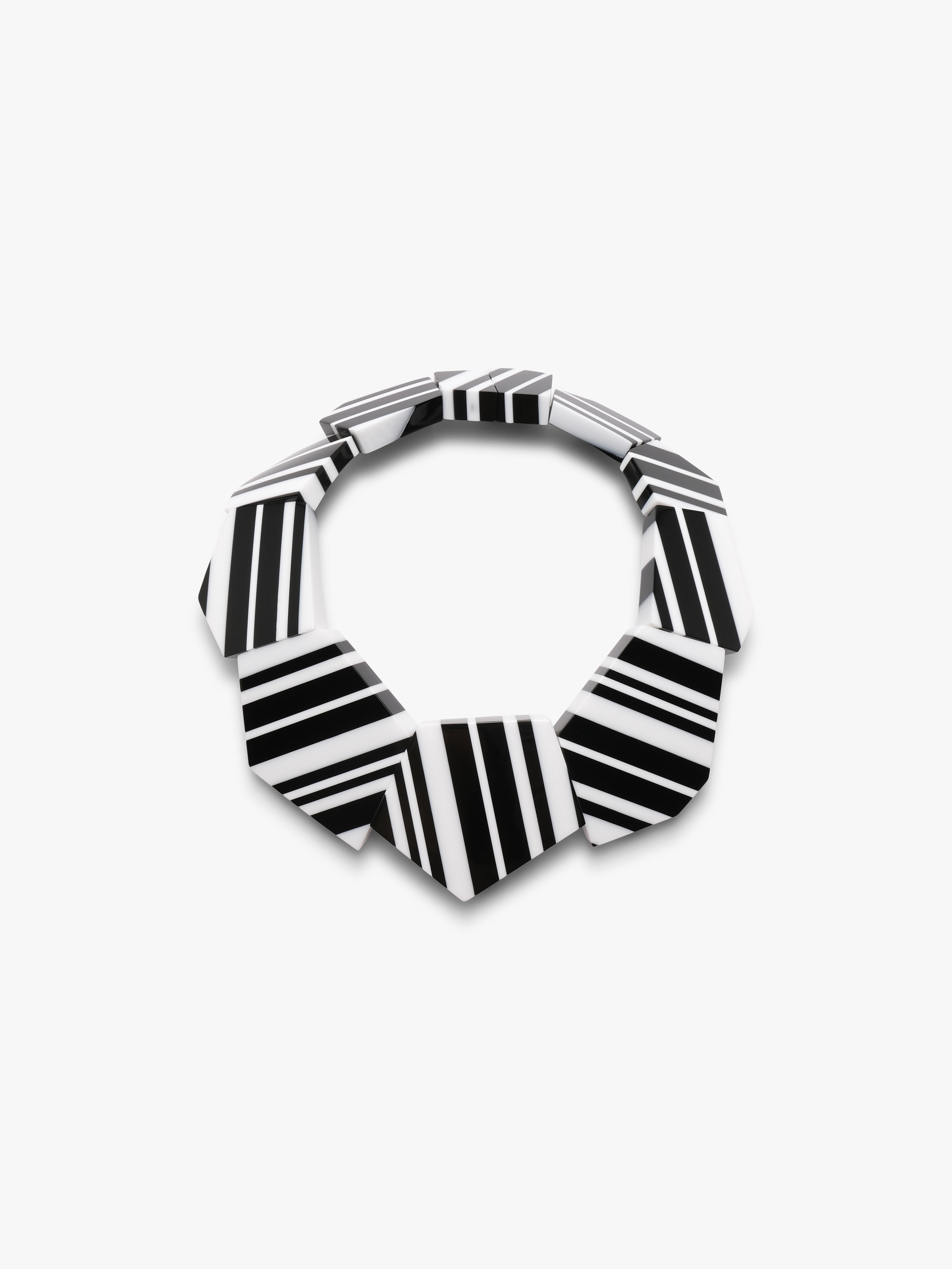Black and white geometric patterned necklace on a white background