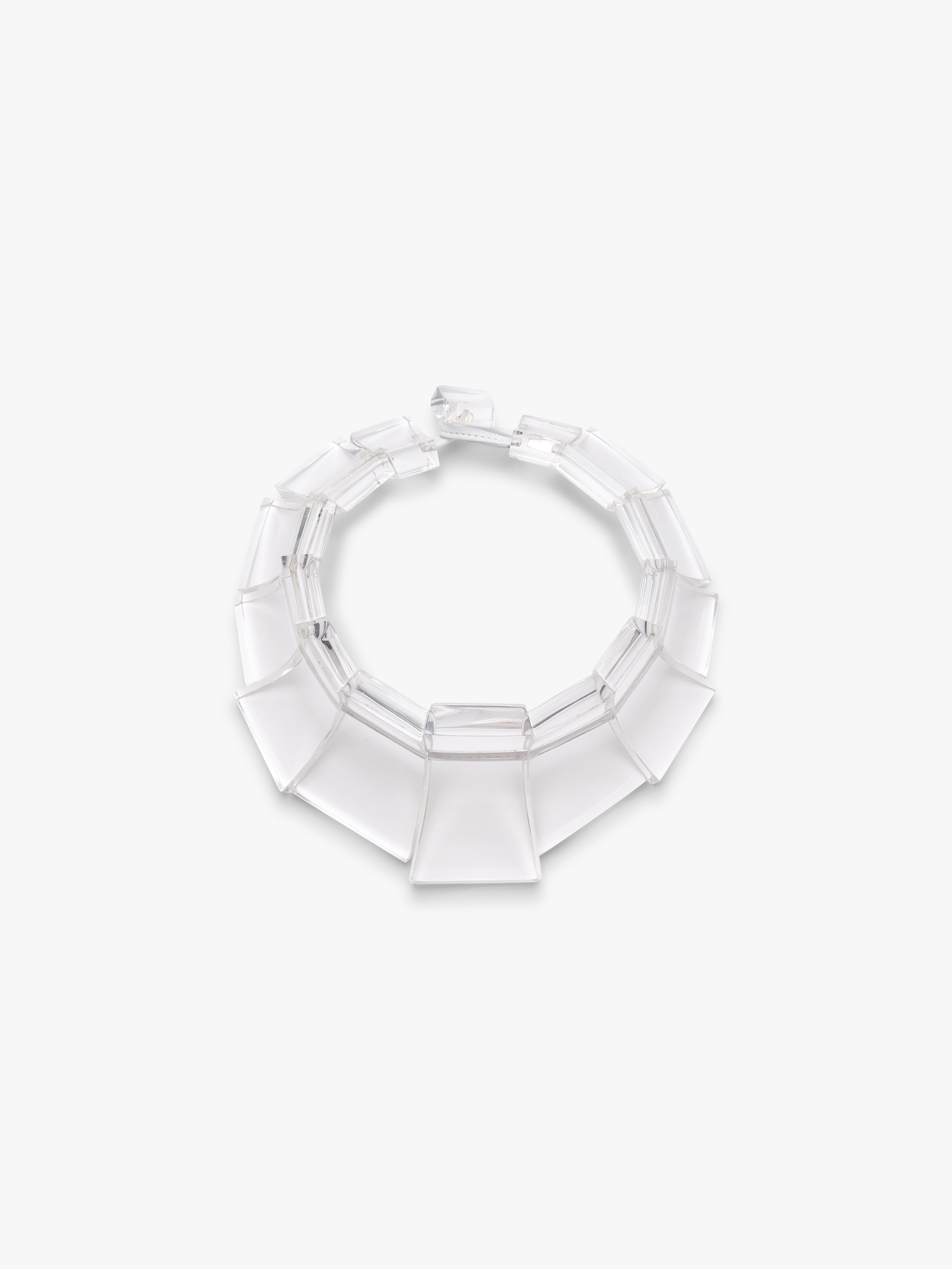 Clear acrylic necklace on a white background