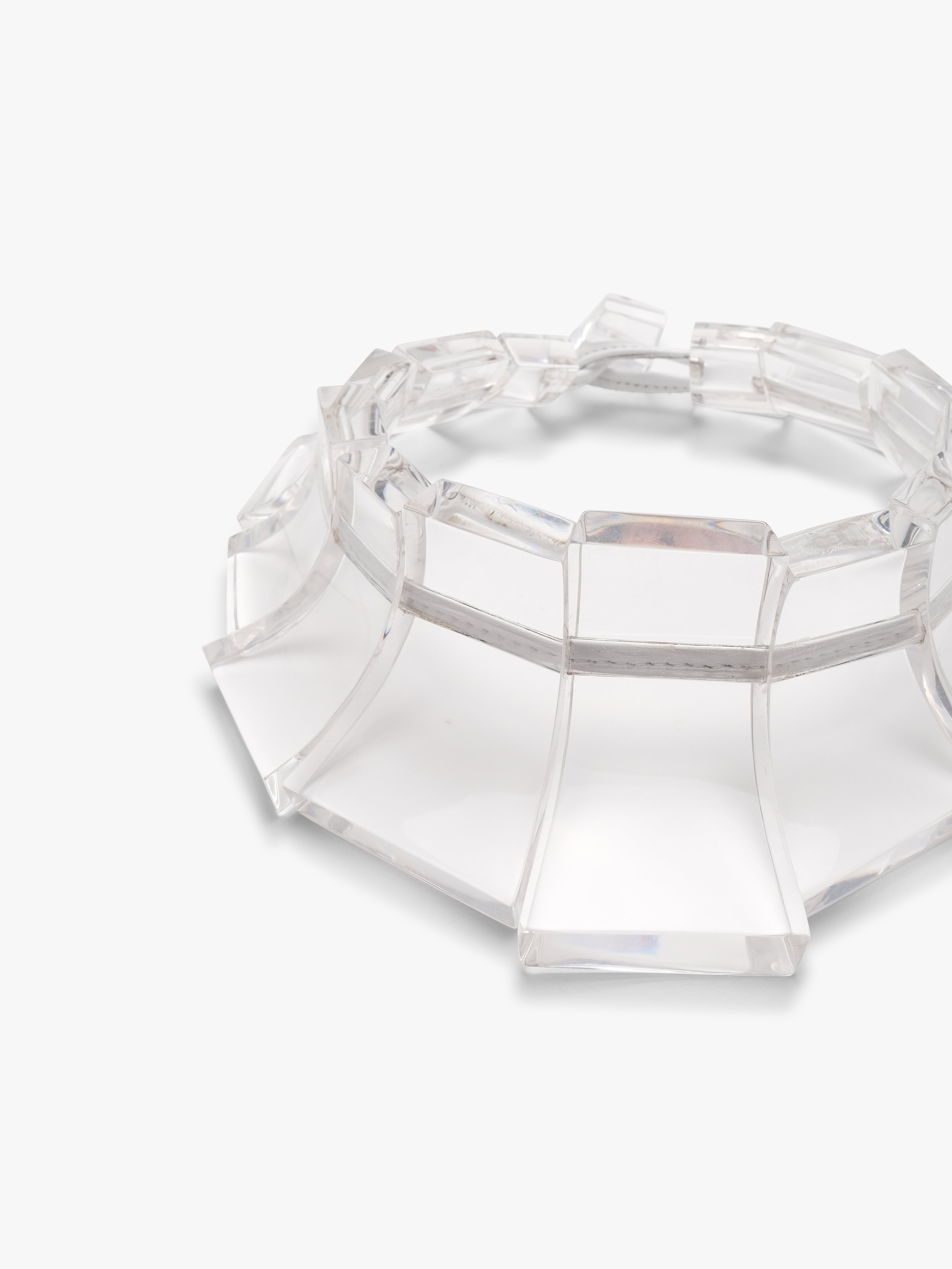 Clear acrylic necklace on a white background