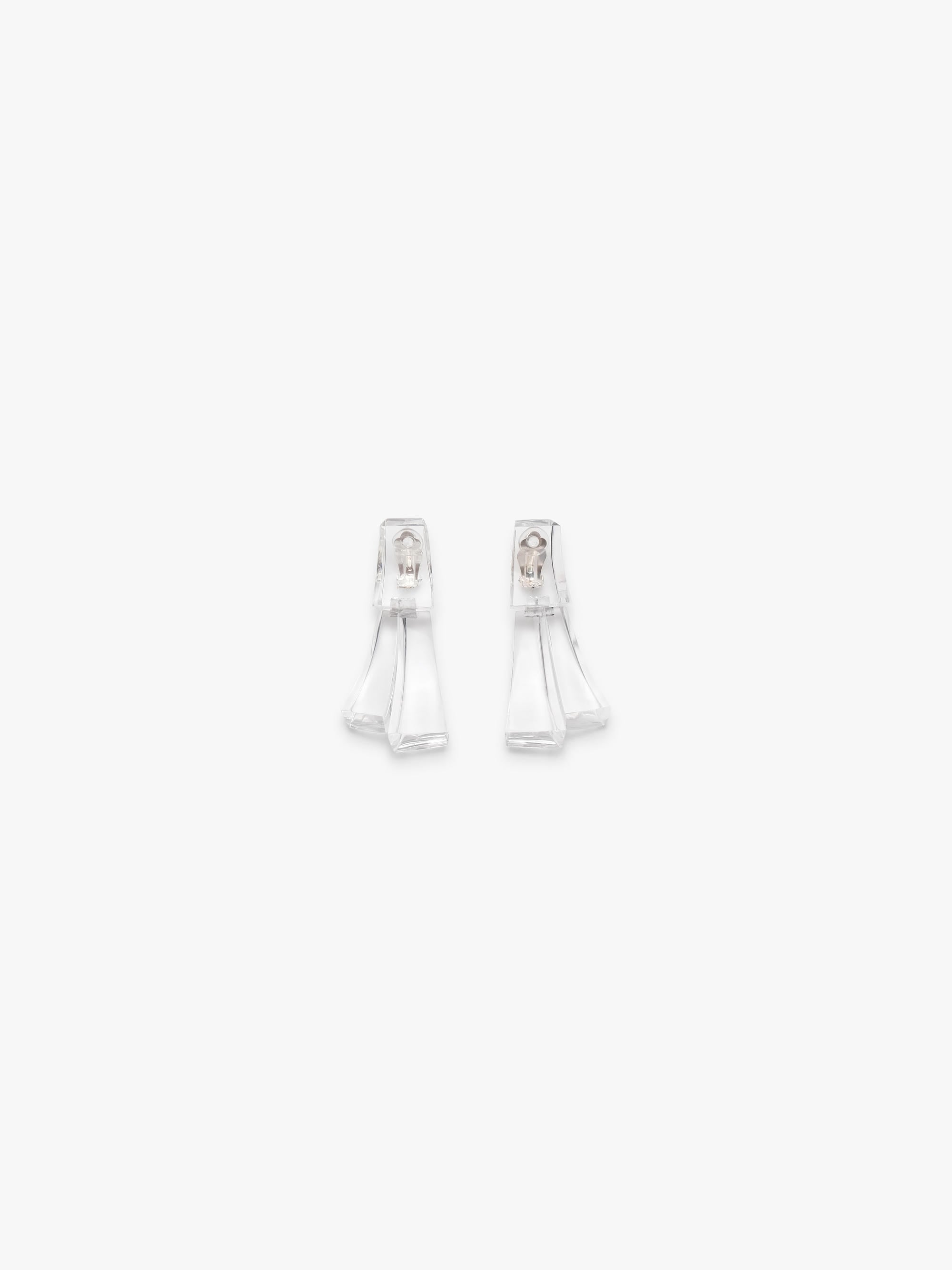 Pair of transparent earrings on a white background