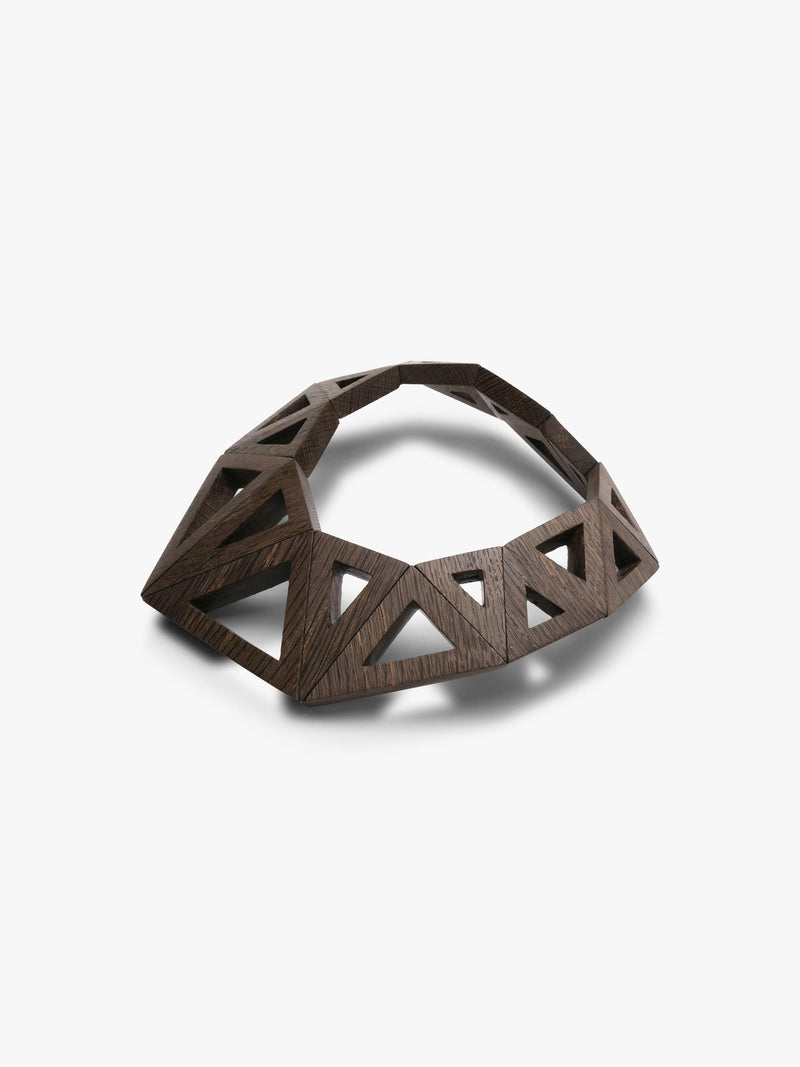 A dark brown geometric wooden necklace with an open, triangular lattice design, photographed on a clean white background.