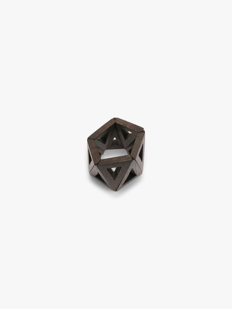 A dark brown geometric wooden bracelet with triangular cutouts, photographed on a clean white background.