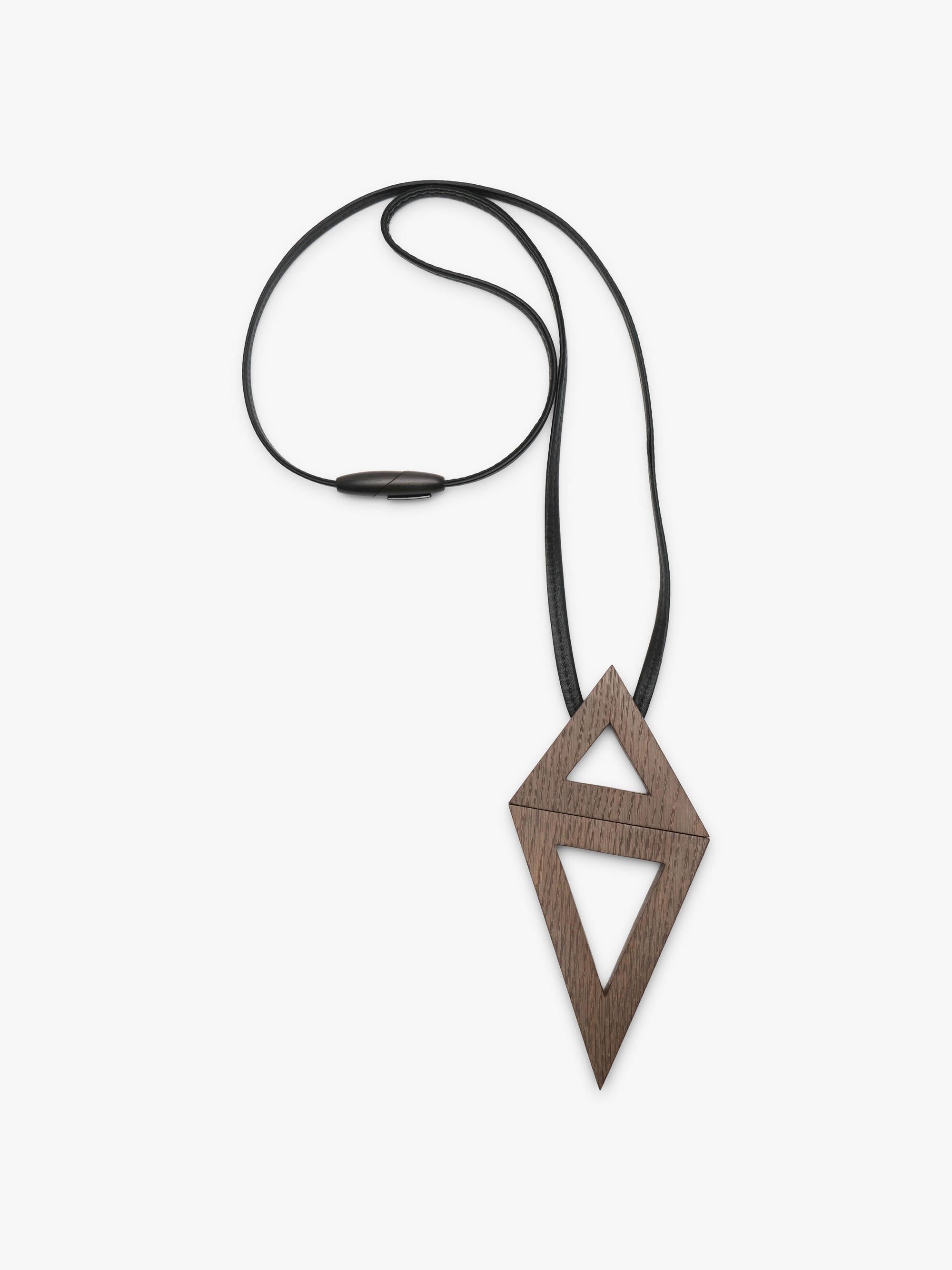 A geometric wooden pendant necklace with a dark brown wood grain finish, suspended on a thin black cord with a small black bead, shown against a plain light gray background.