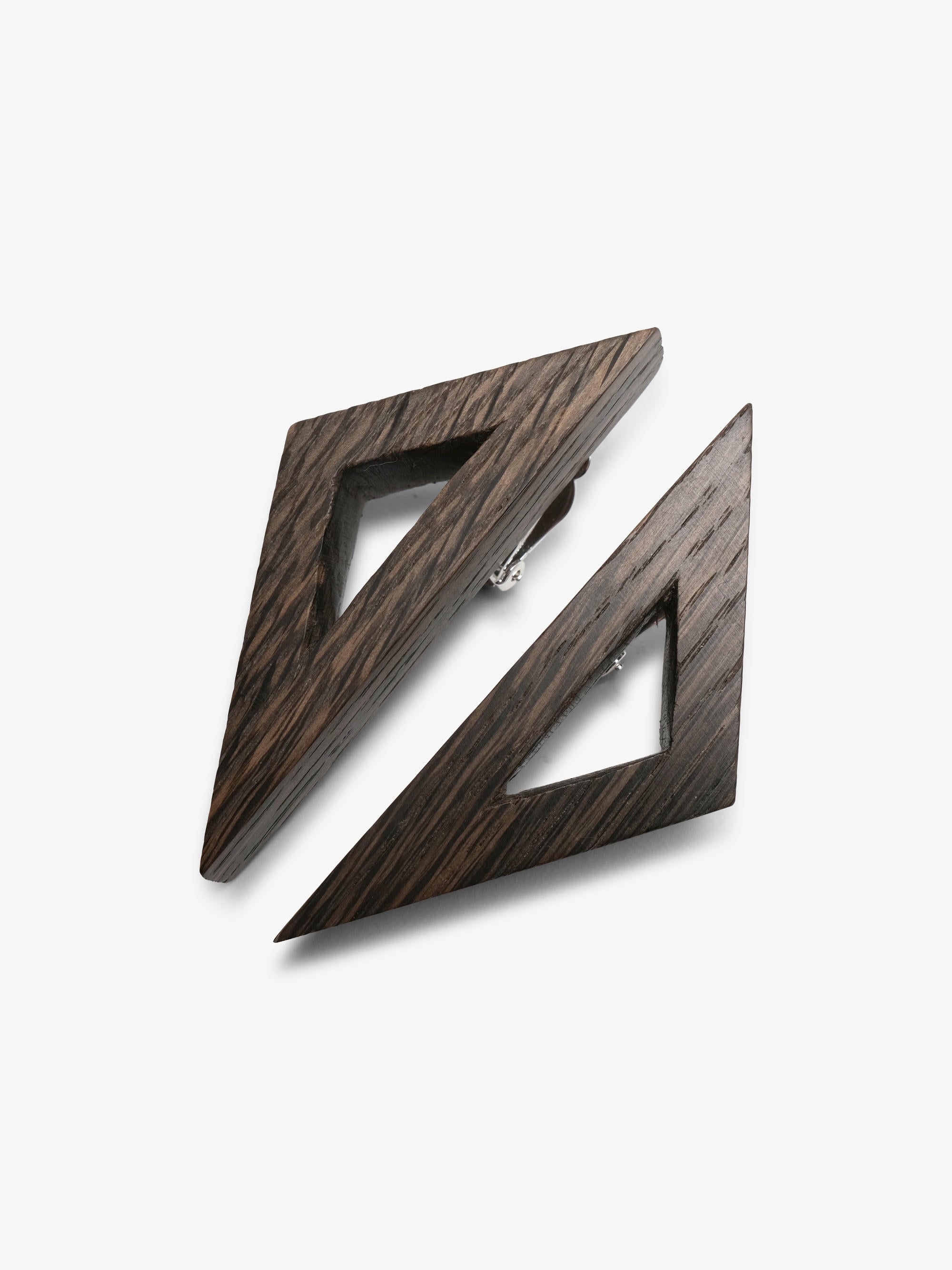 Wooden geometrical earrings on a white background