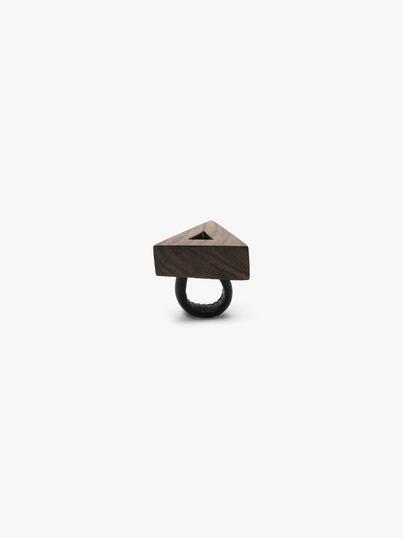 A triangular wooden ringwith a natural wood grain finish with a black leather band, shown on a plain light gray background.