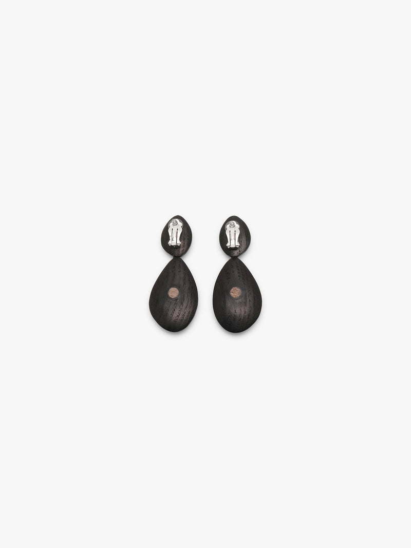 two drop shaped earrings in warm redish coloured wood, photographed on a white background