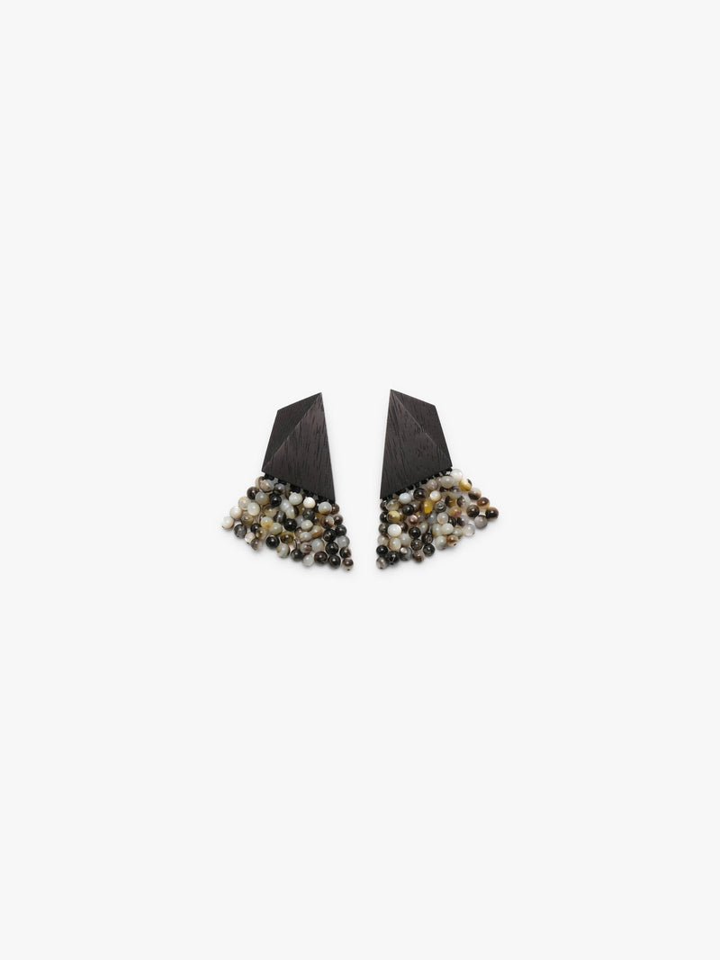 Pair of wood and pearl earrings on a white background