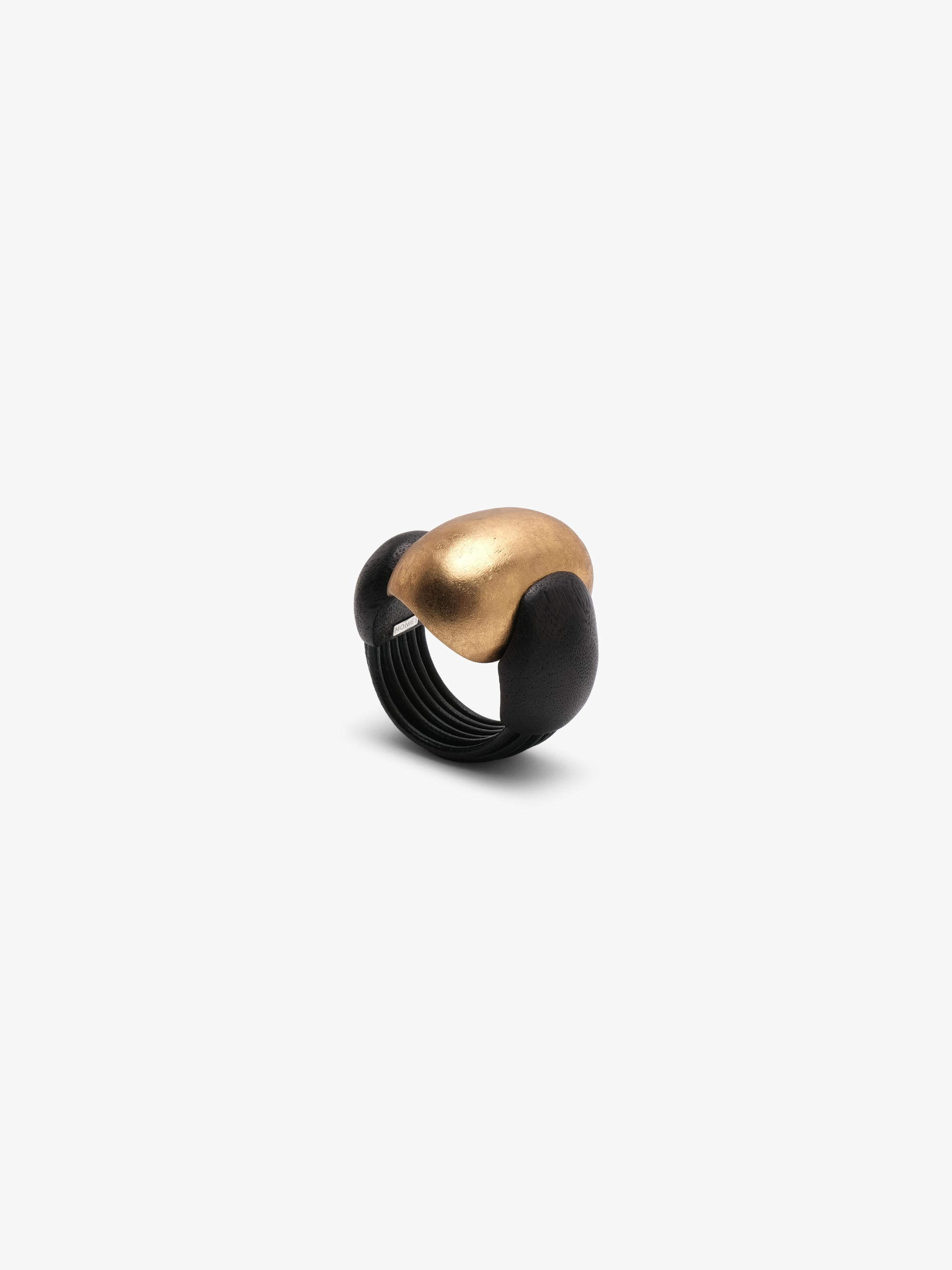 Gold and black bracelet on a white background