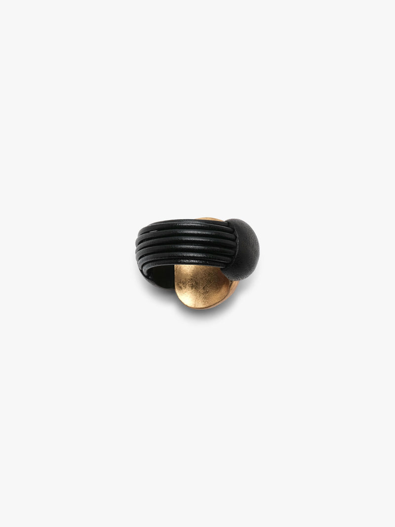 Gold and black bracelet on a white background