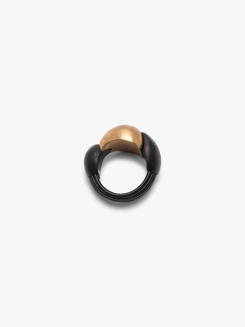 Gold and black bracelet on a white background