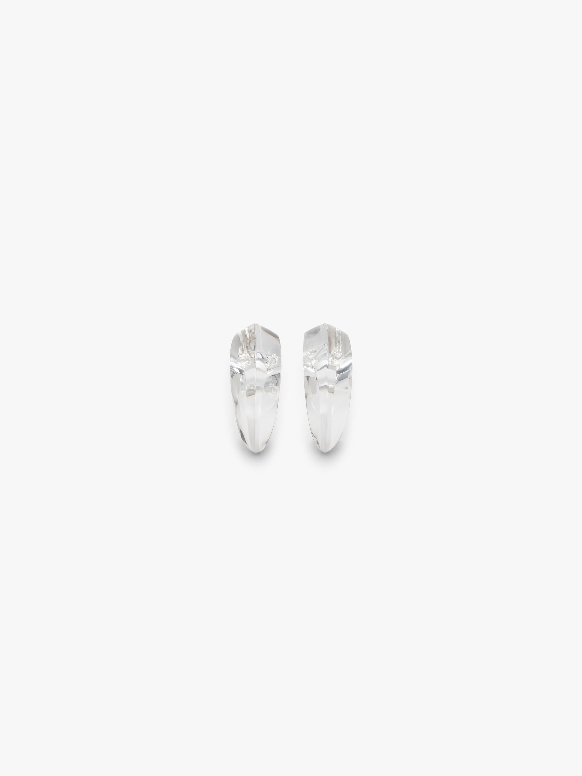 transparent curved earrings displayed on a white background