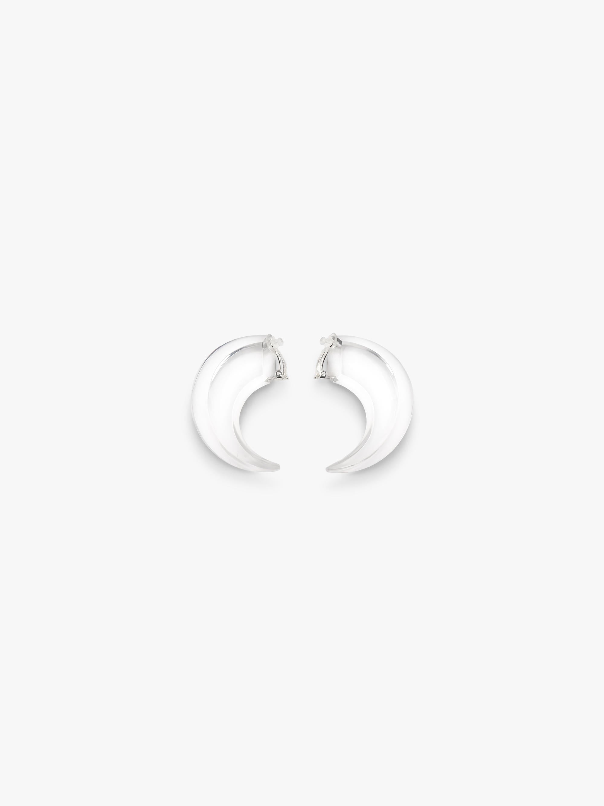 transparent curved earrings displayed on a white background