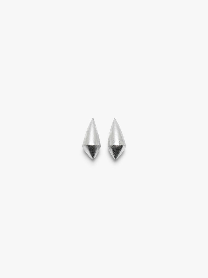 A pair of elongated earrings covered in silverfoil, displayed on a white background