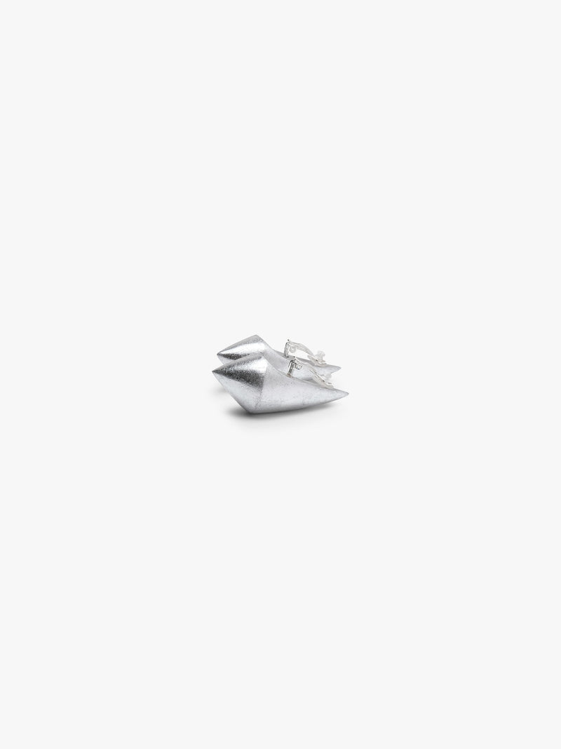 A pair of elongated earrings covered in silverfoil, displayed on a white background