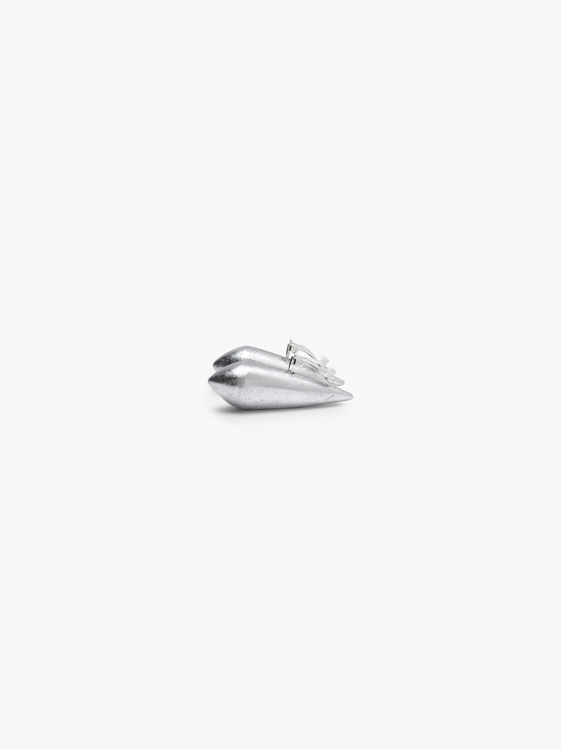 Handcrafted from acacia with a silverfoil finish, these earrings have an elongated sculptural shape with softly faceted surfaces.