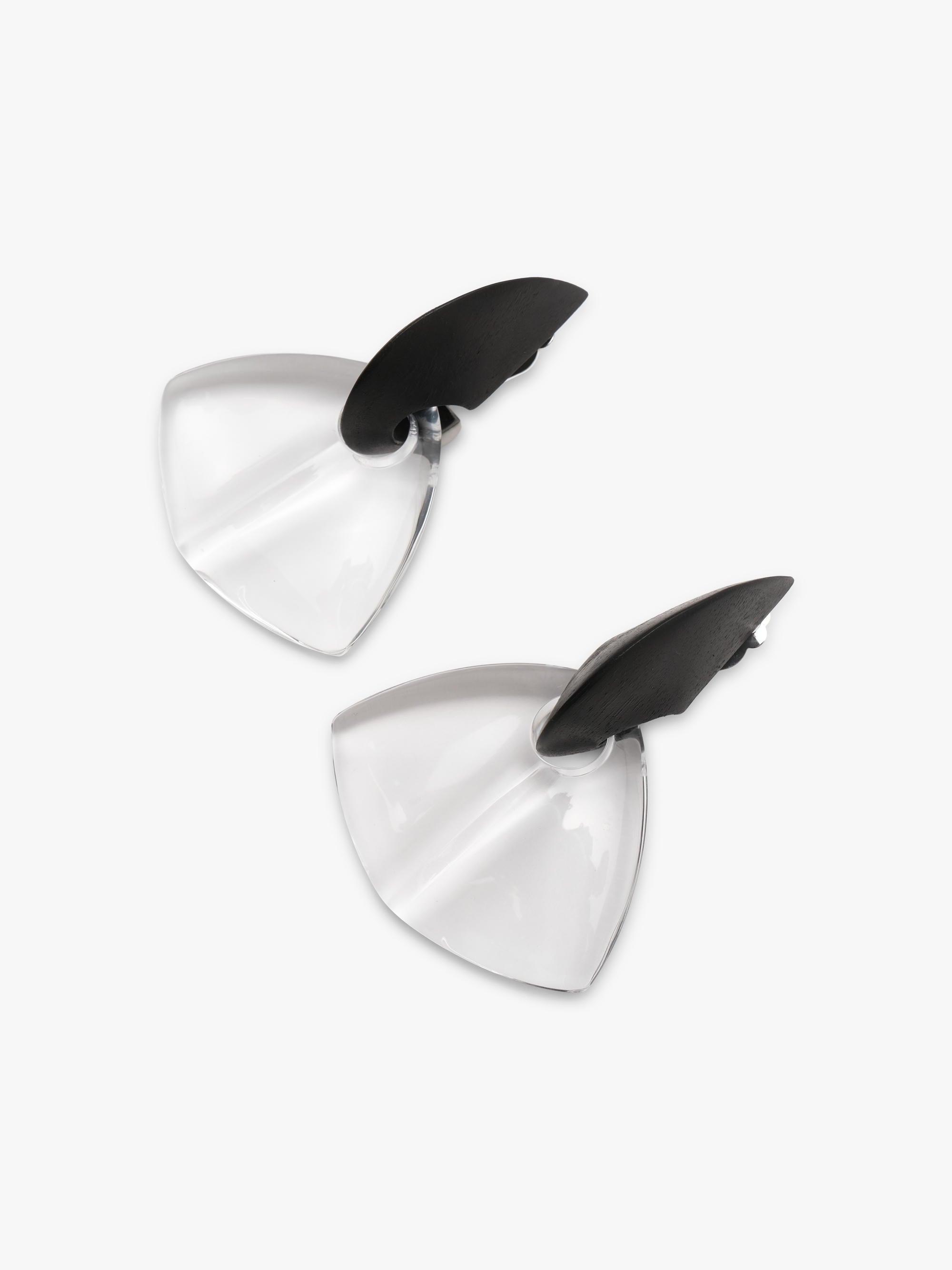two earrings with a black top and transparent bottom, displayed on a white background