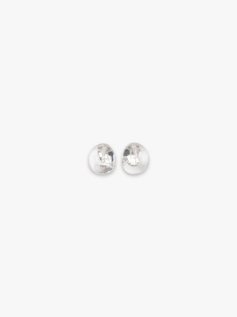 A pair of rounded transparent earrings, displayed on a white background