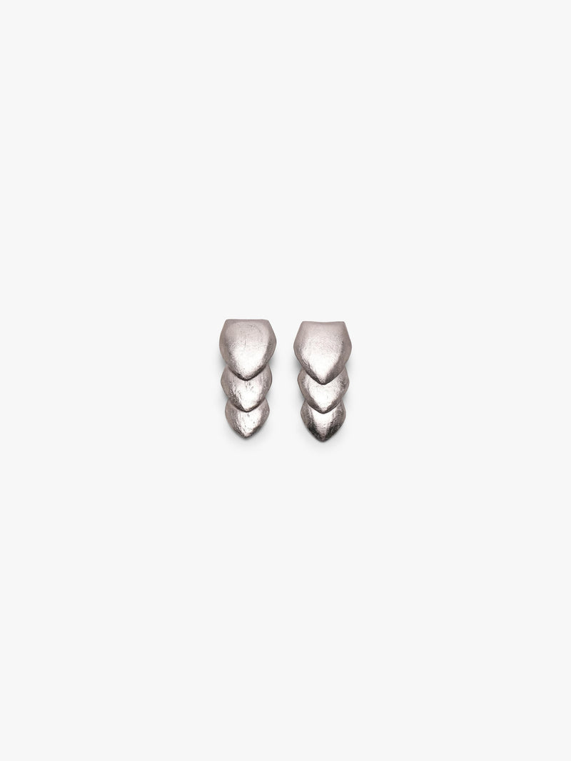 Silver earrings with a flower padel kike structure, displayed on a white background