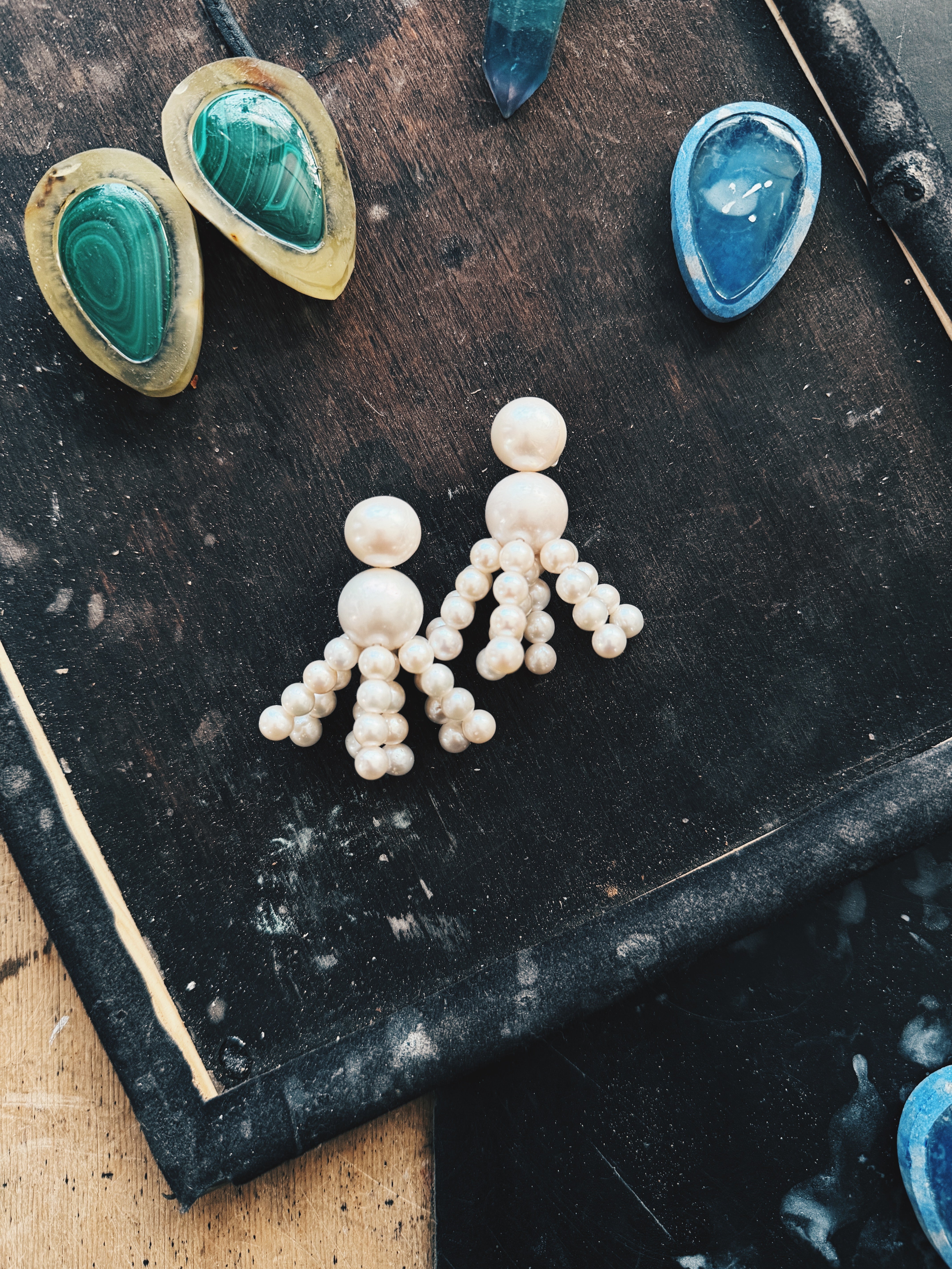 Earrings: freshwater pearls, horn