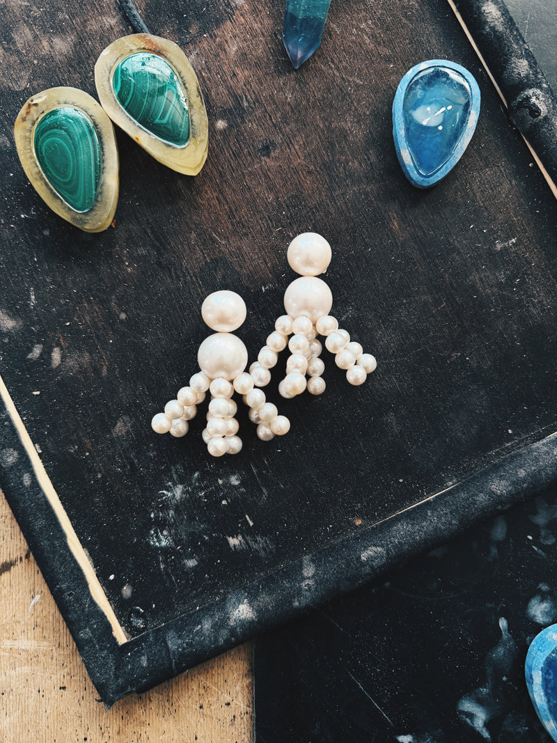 Earrings: freshwater pearls, horn