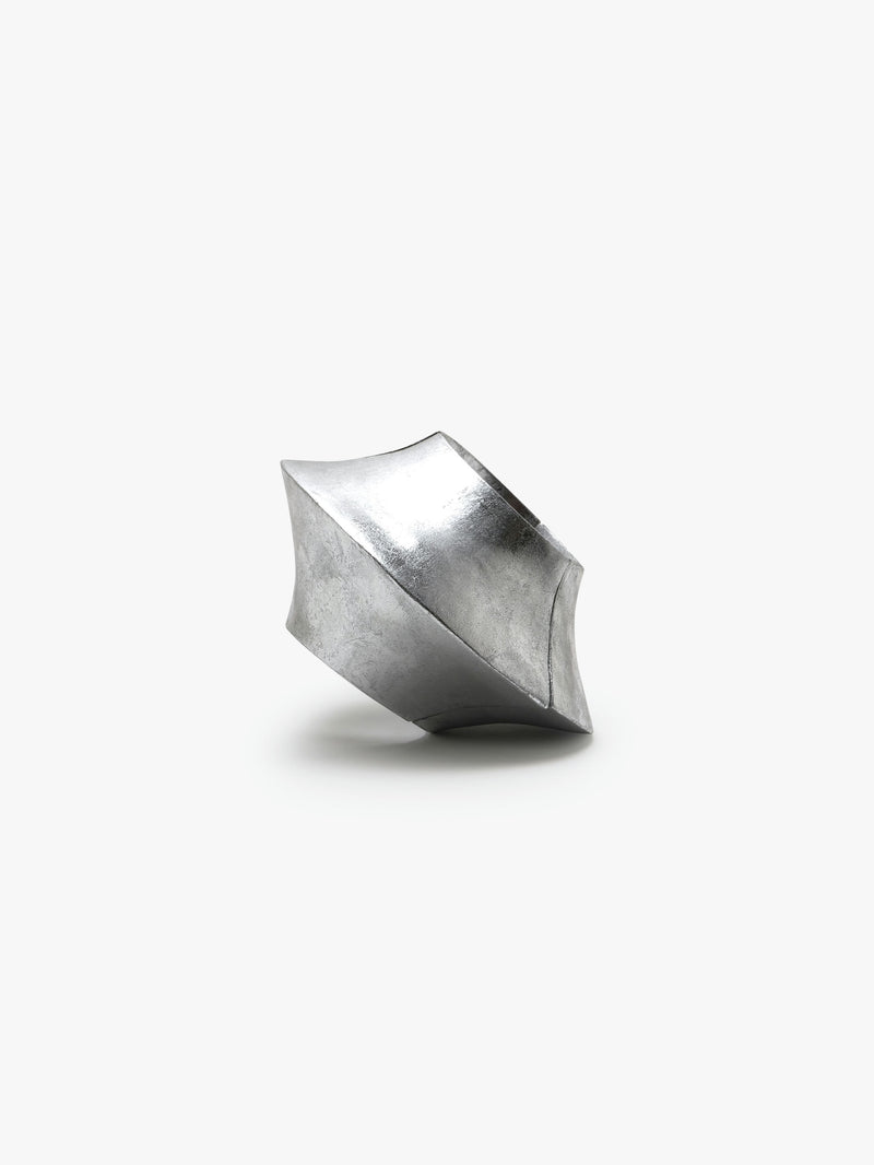 A silver foil bracelet with an elastic band, displayed on a plain background.