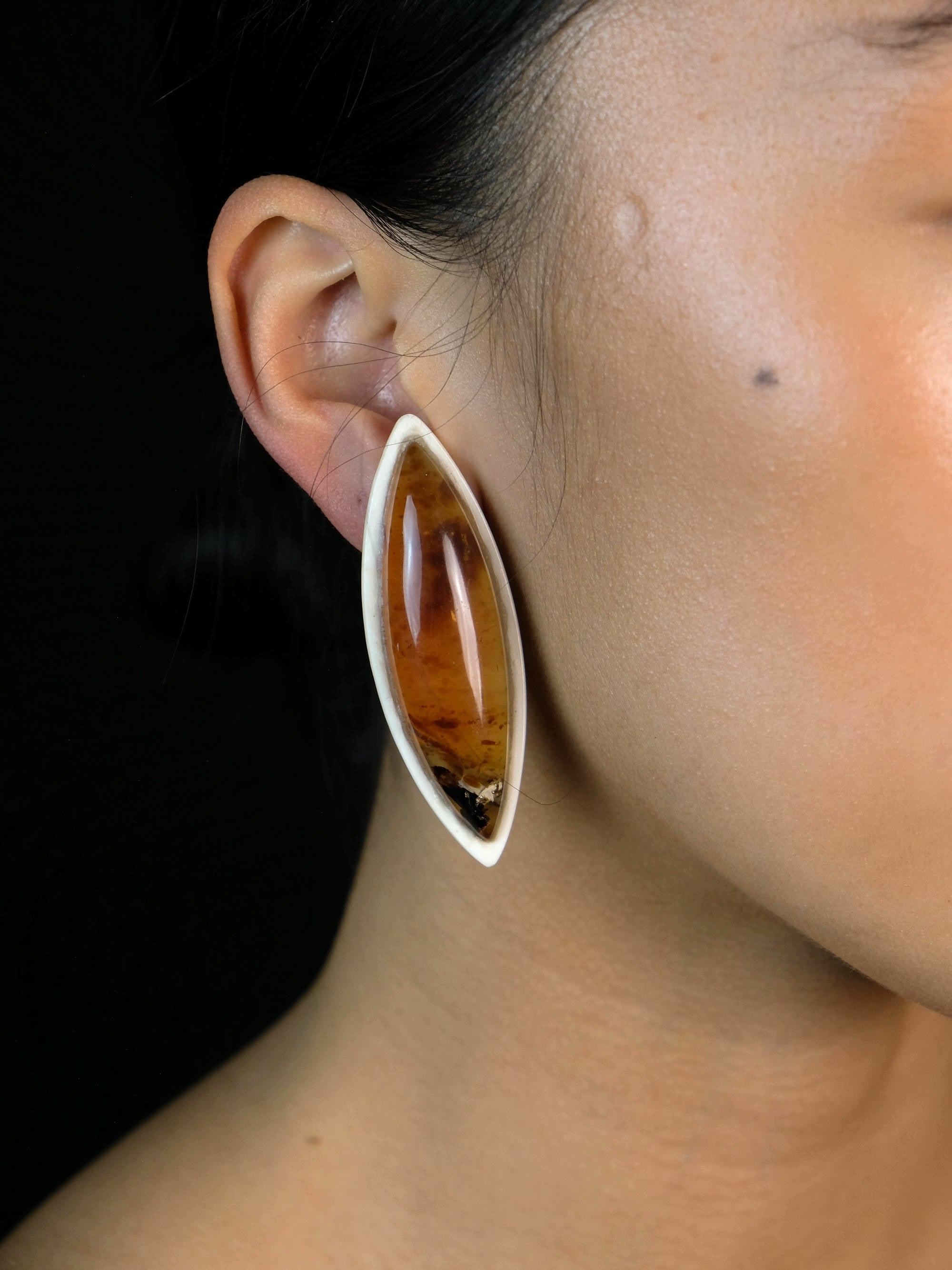 Earrings: amber, bone