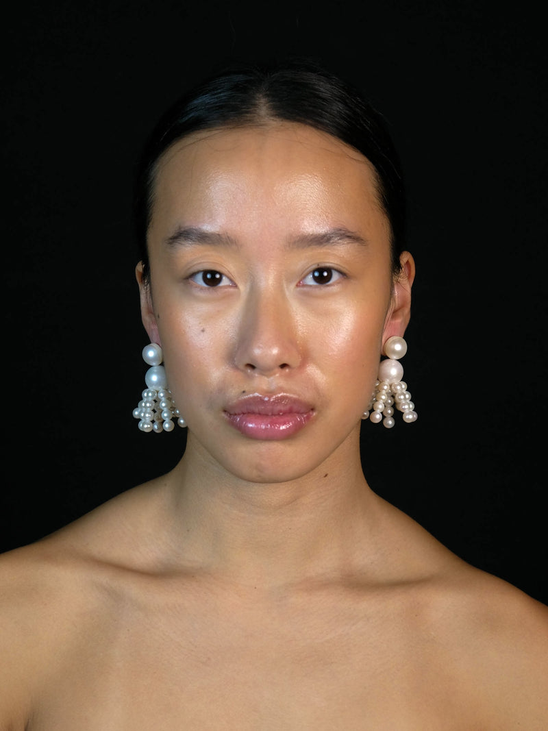 Earrings: freshwater pearls, horn