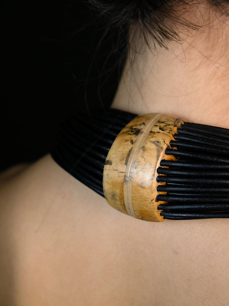 Necklace: mammoth bone, leather