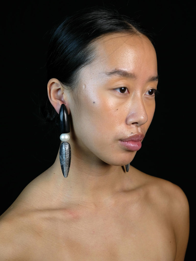 Earrings: horn, freshwater pearls, orthorecas