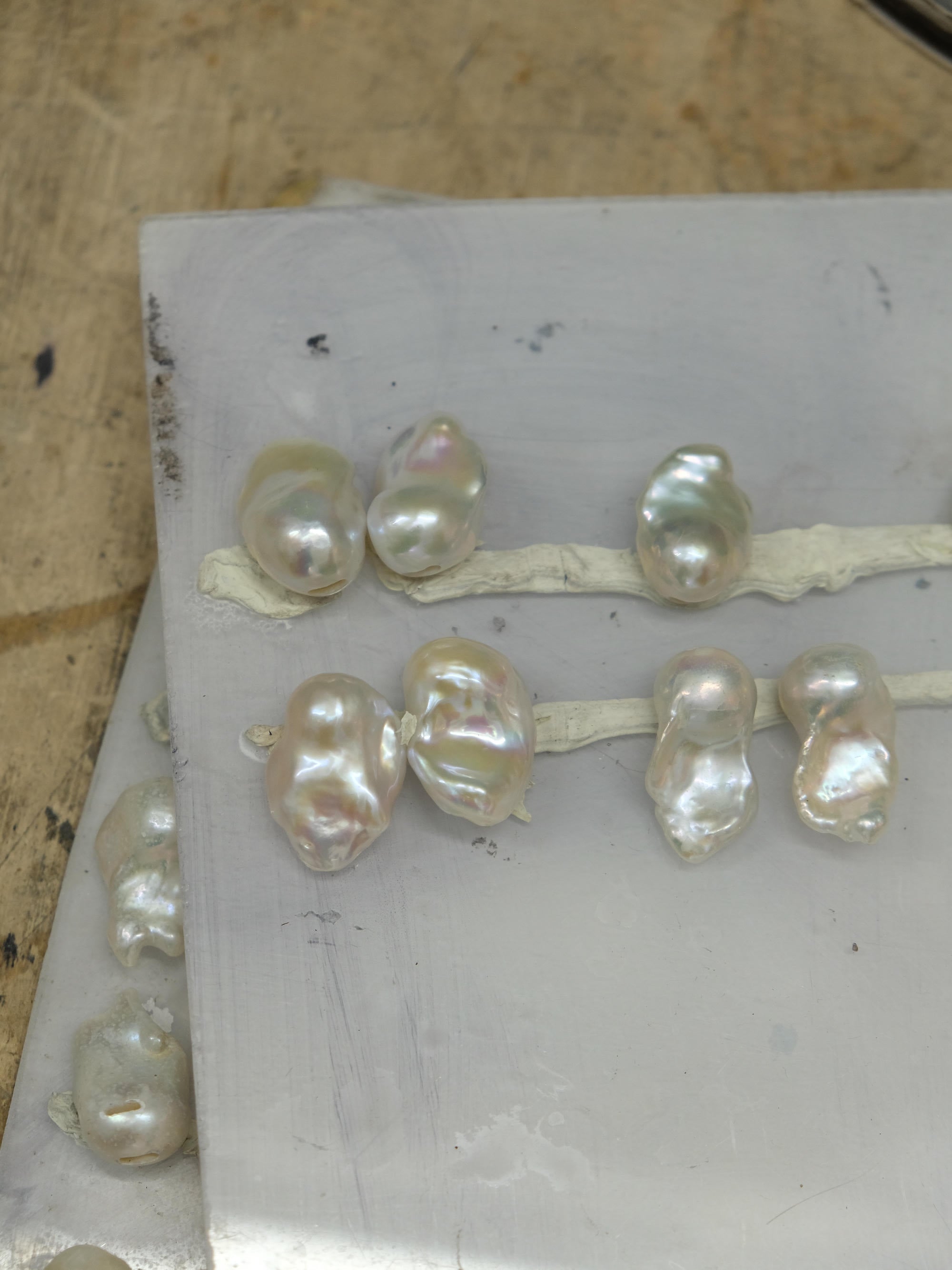 baroque pearls laying in a workshop