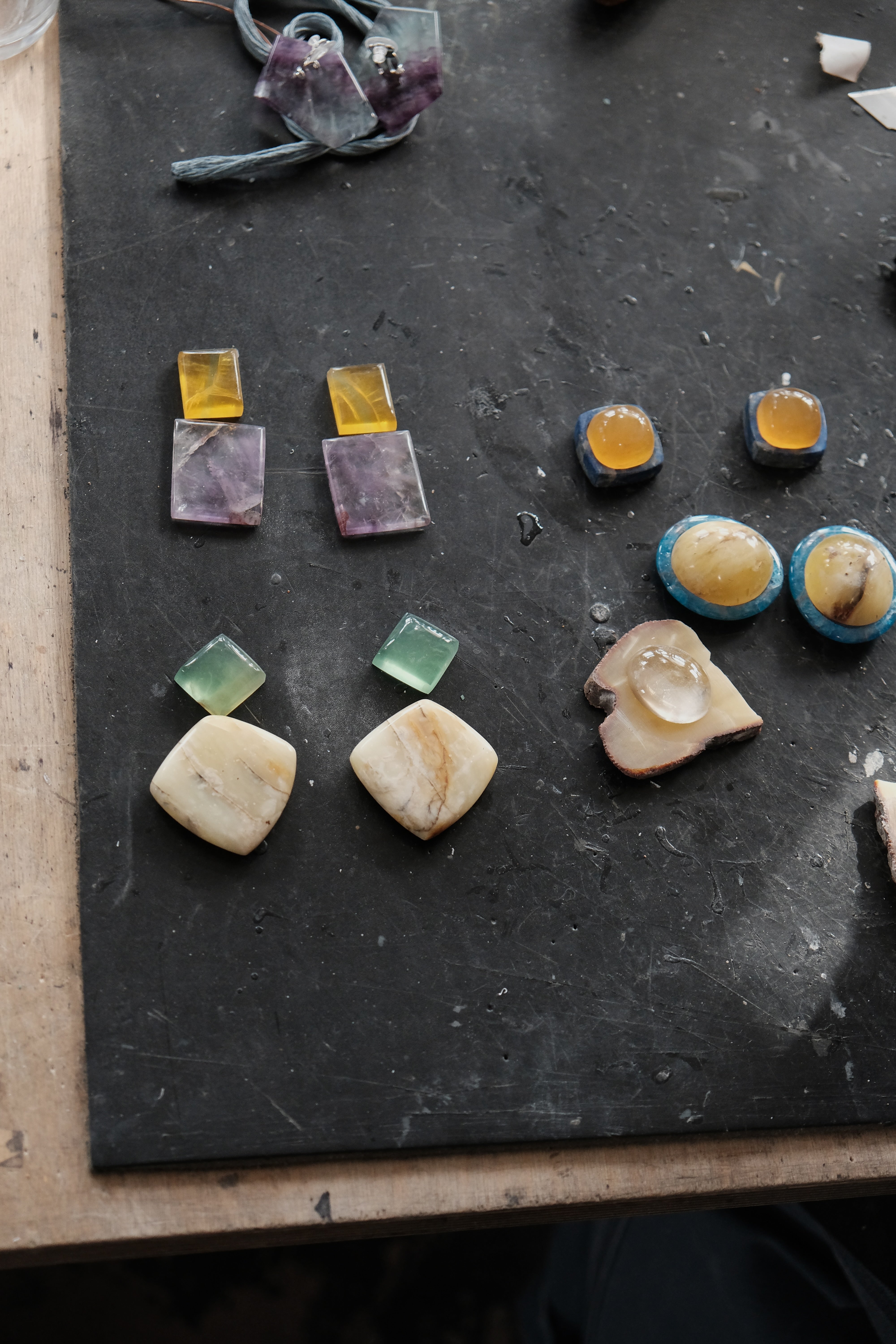Different gemstones layed out on a workshop style environment