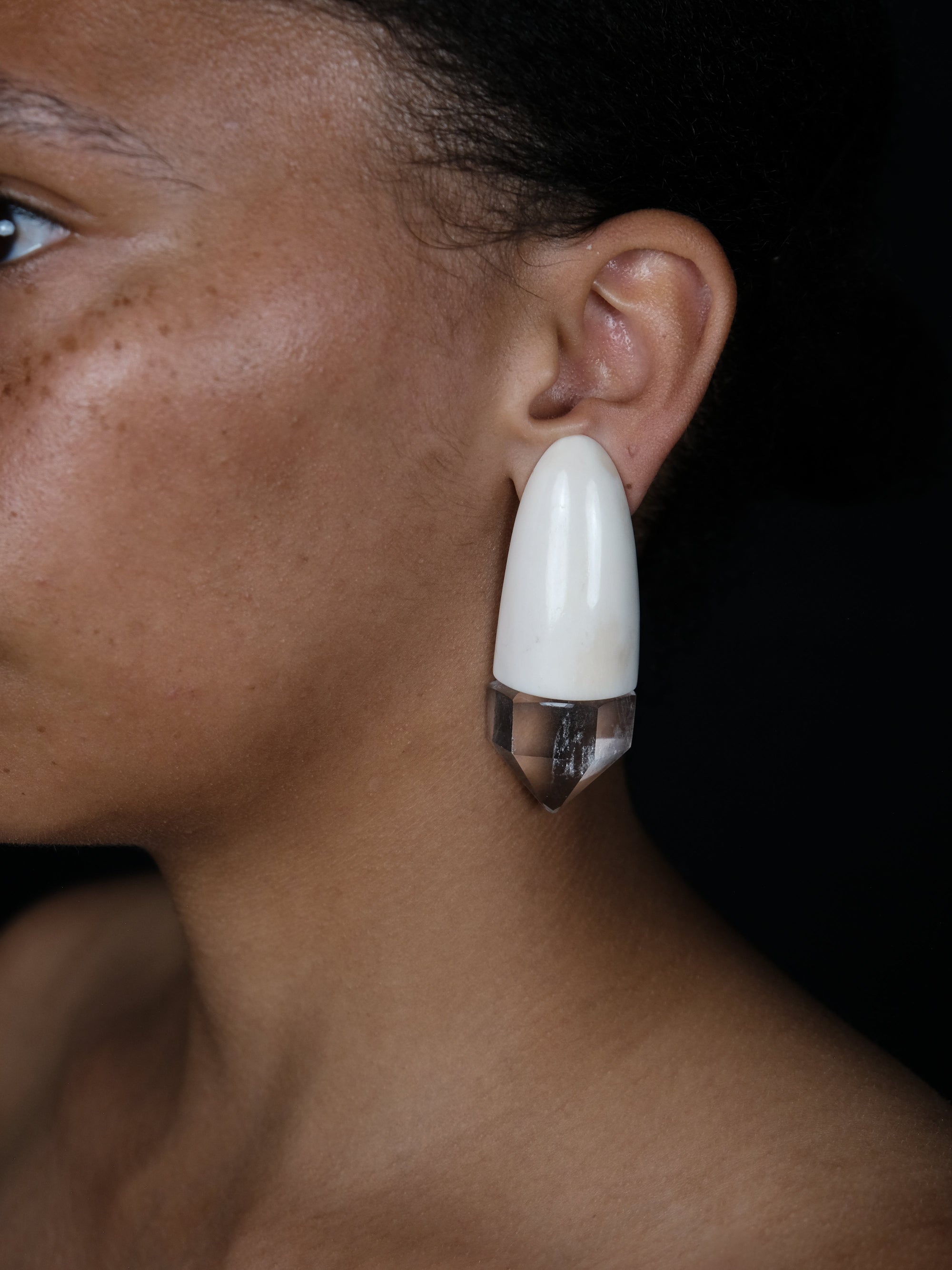 Earrings: bone, quartz