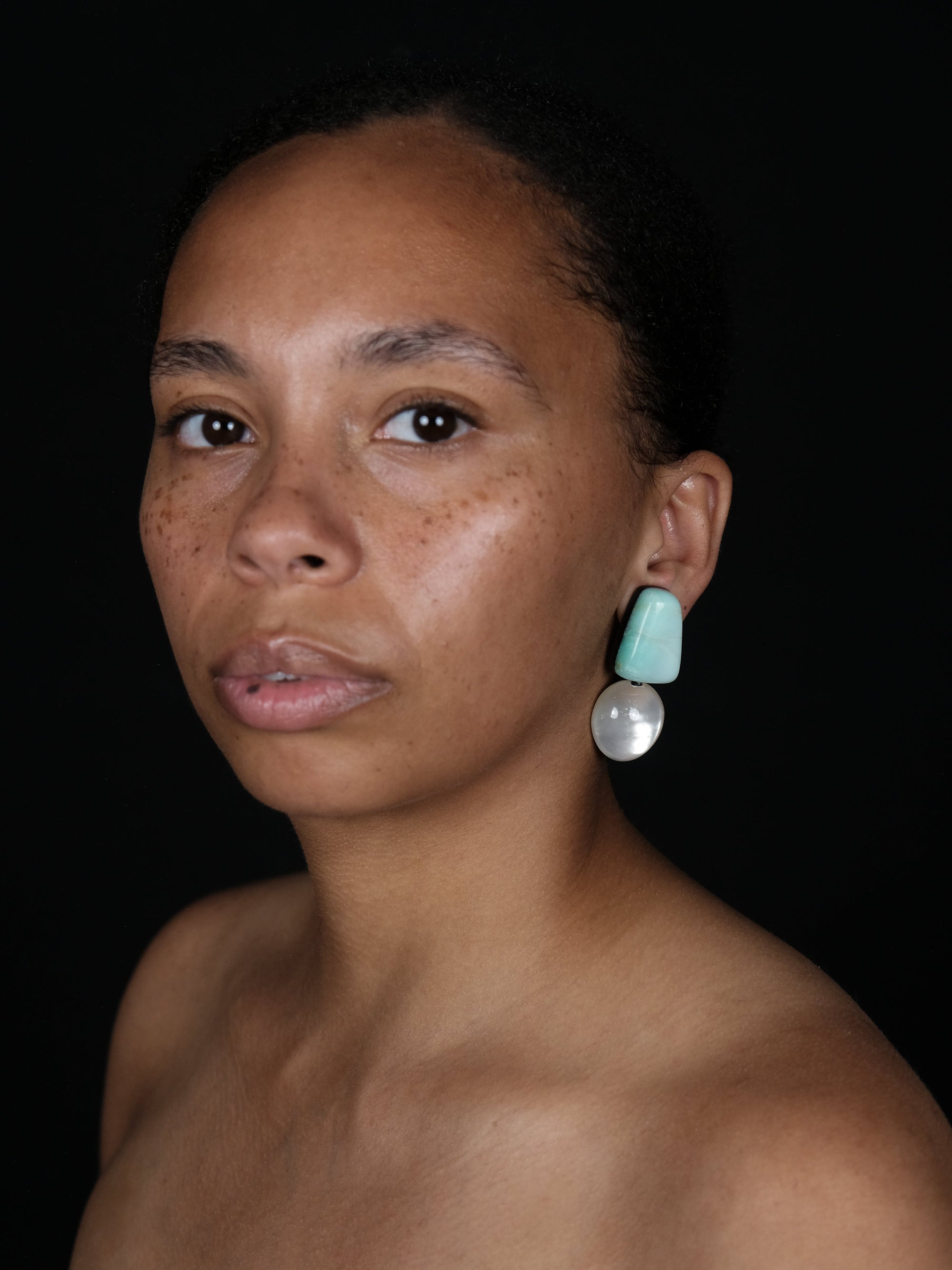 Earrings: chrysoprase, leather, mountain crystal, mother of pearl