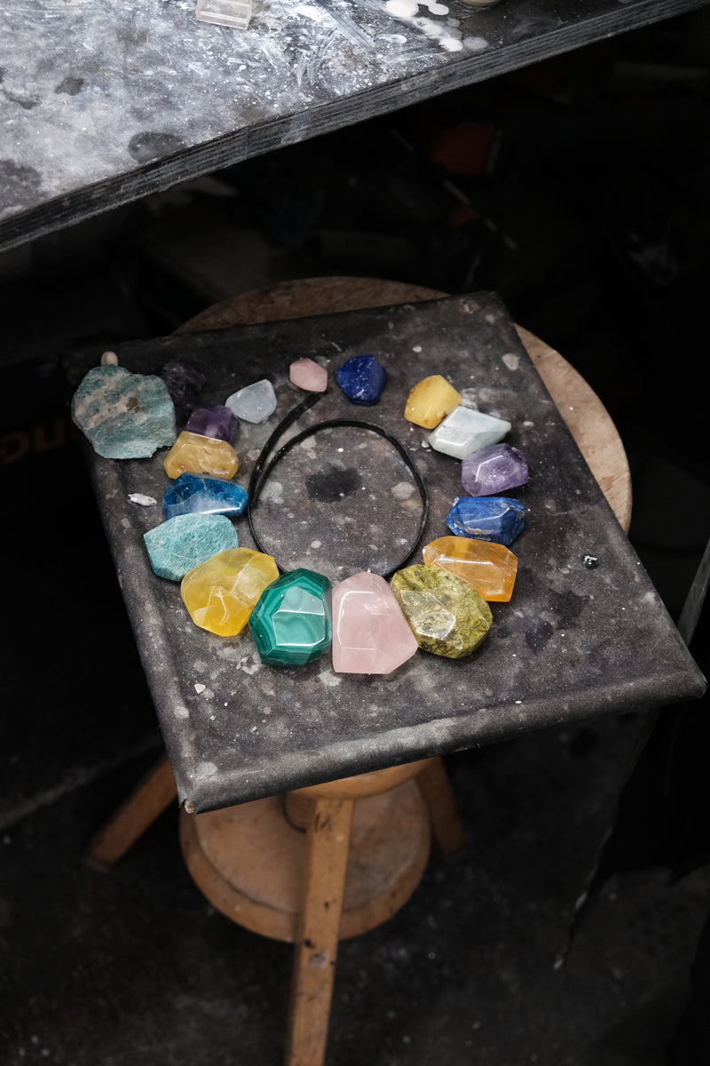 Colourful stones layed out in a workshop environment