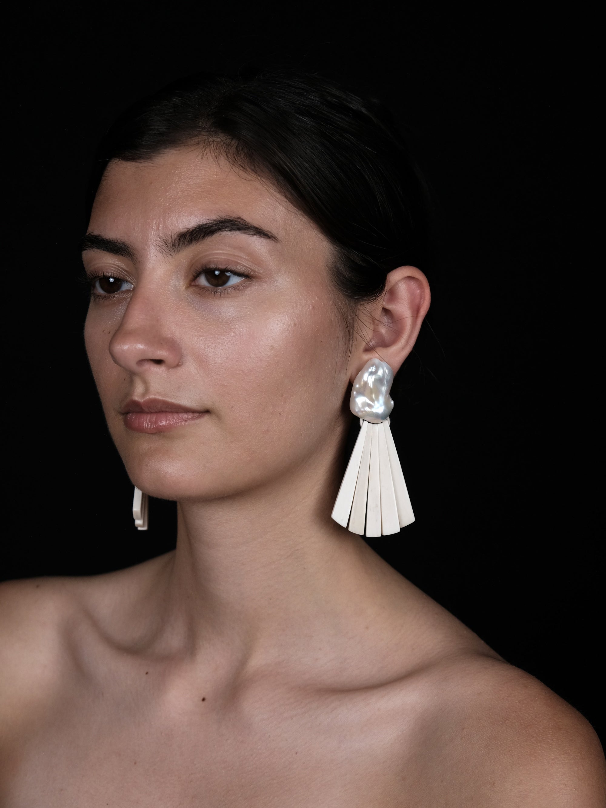 Earrings: baroque pearl, bone