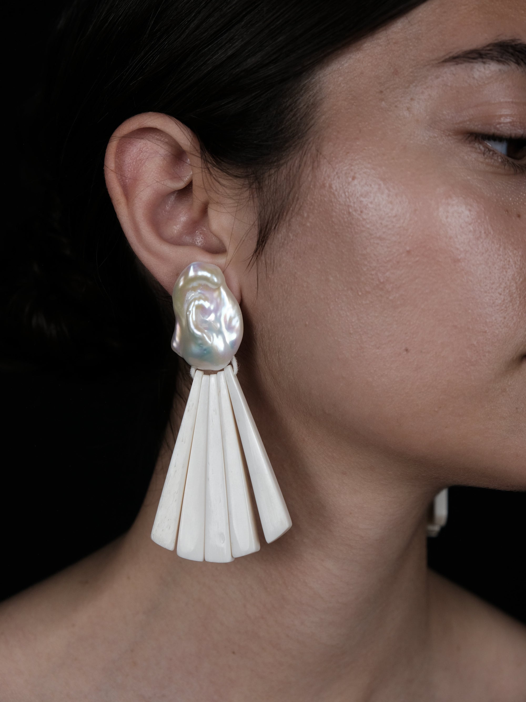 Earrings: baroque pearl, bone